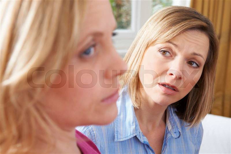 Unhappy Woman In Conversation With Friend Or Counsellor, stock photo