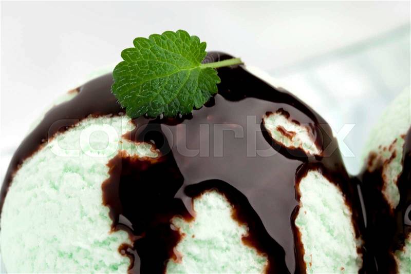 Cloes up of mint ice cream ball with chocolate topping, stock photo