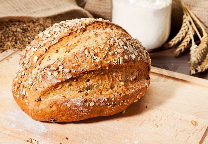 Whole grain bread with ingredients, stock photo