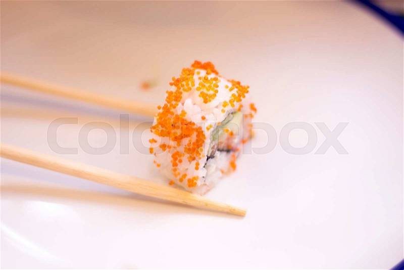 Japanese restaurant sushi oriental raw fish smoked salmon food dish and traditional Asian wooden chopsticks photo, stock photo