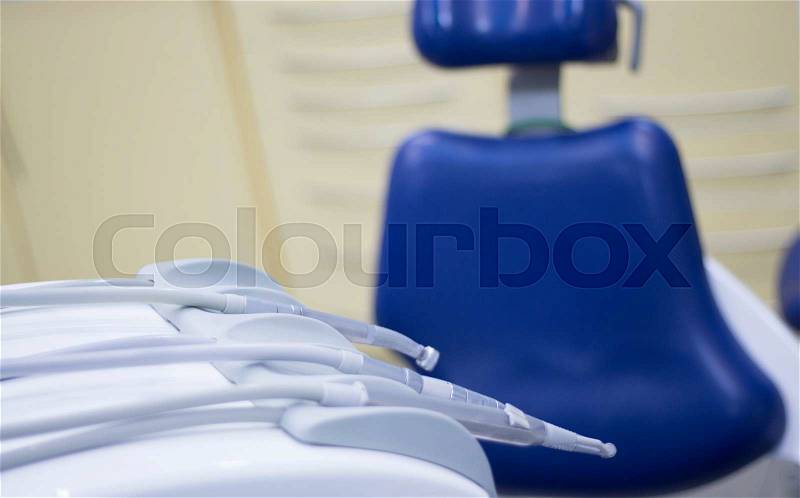 Dentist\'s chair and dental drill in hospital clinic, stock photo