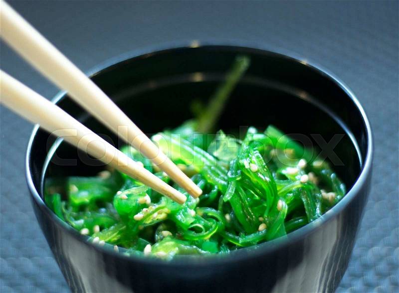 Japanese restaurant sushi oriental seaweed sushi como wakame food dish in bowl and traditional Asian wooden chopsticks photo, stock photo