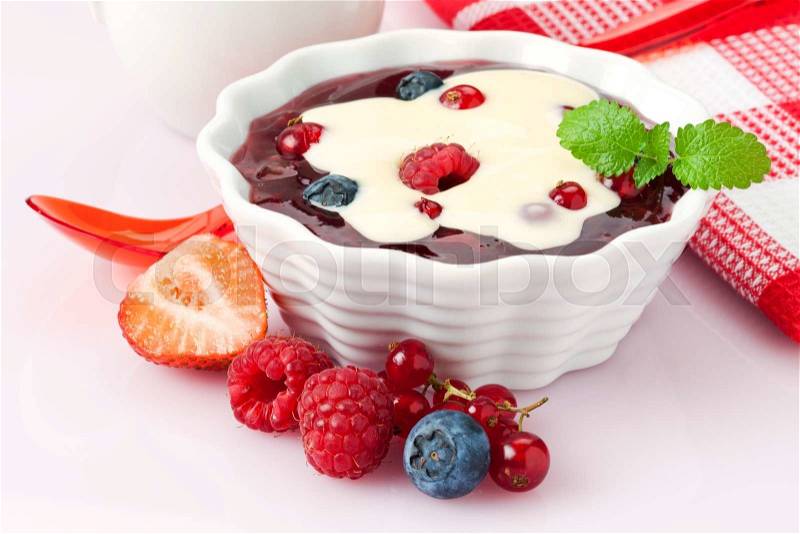 Compote of berry fruits with vanilla topping, stock photo