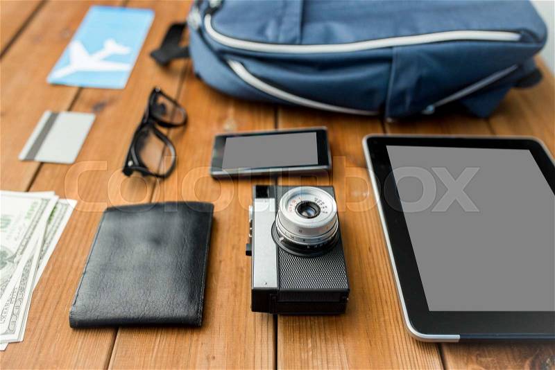 Travel, tourism, technology and objects concept - close up of camera, gadgets and personal stuff, stock photo