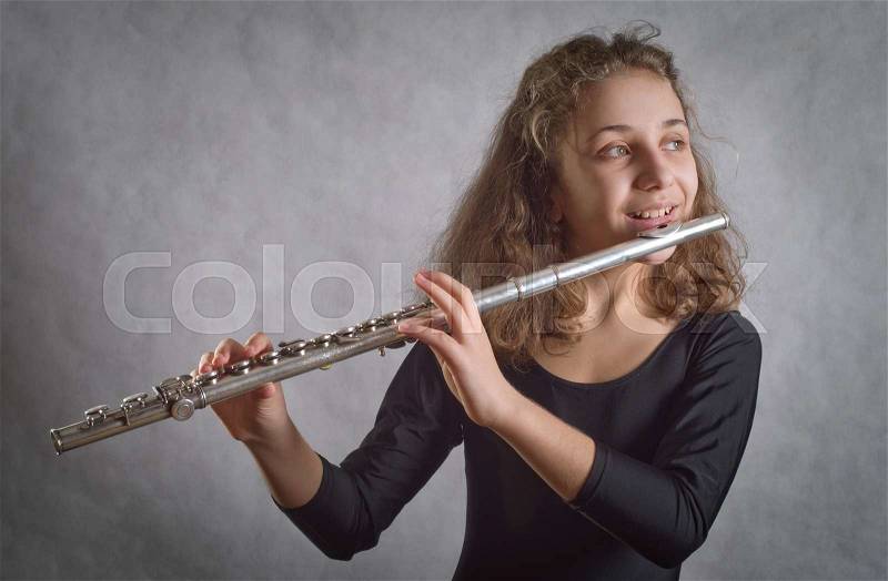 Girl Playing Flute, stock photo