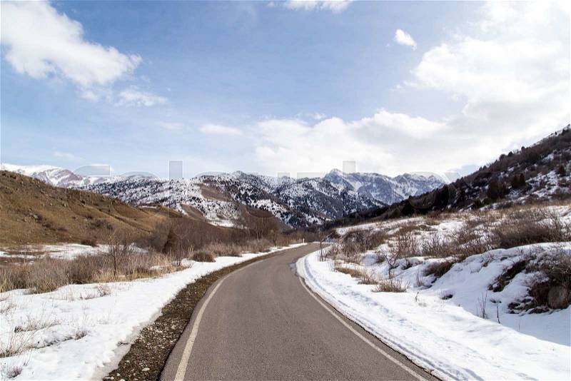 Winter road in the mountains of Kazakhstan, stock photo