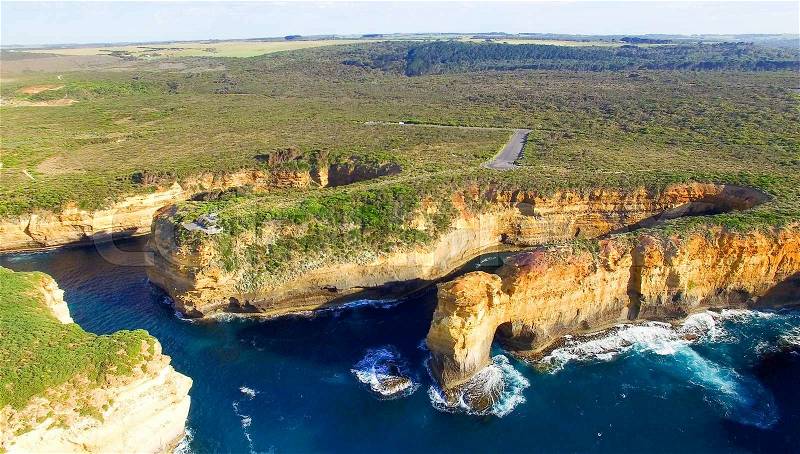 Loch Ard Gorge and Arch Island on the Great Ocean Road, aerial view, stock photo