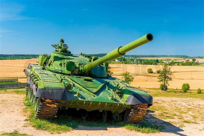 Fighting tank T-72 green color in the field, stock photo