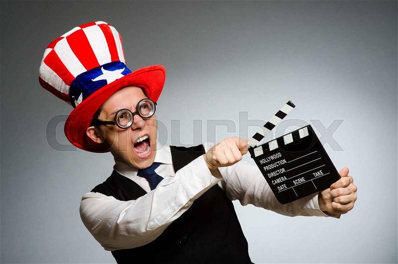 Man with american hat and movie board, stock photo