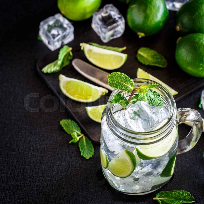 Cold drink with lime and mint in a glass, stock photo