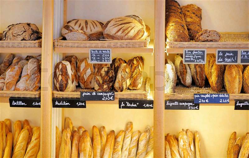 Freshly baked gourmet breads for sale in French bakery , stock photo