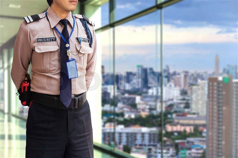 Security guard on modern office building, stock photo
