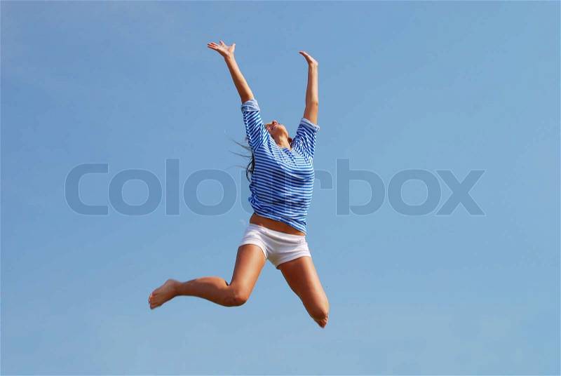 Jumping woman against sky background, stock photo