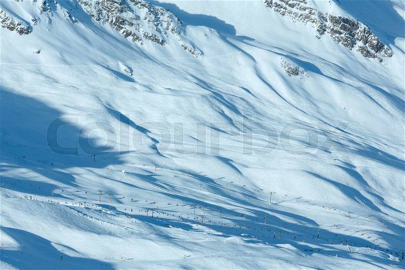 Scenery from the cabin ski lift at the snowy slopes (Tyrol, Austria). All skiers are unrecognizable. , stock photo