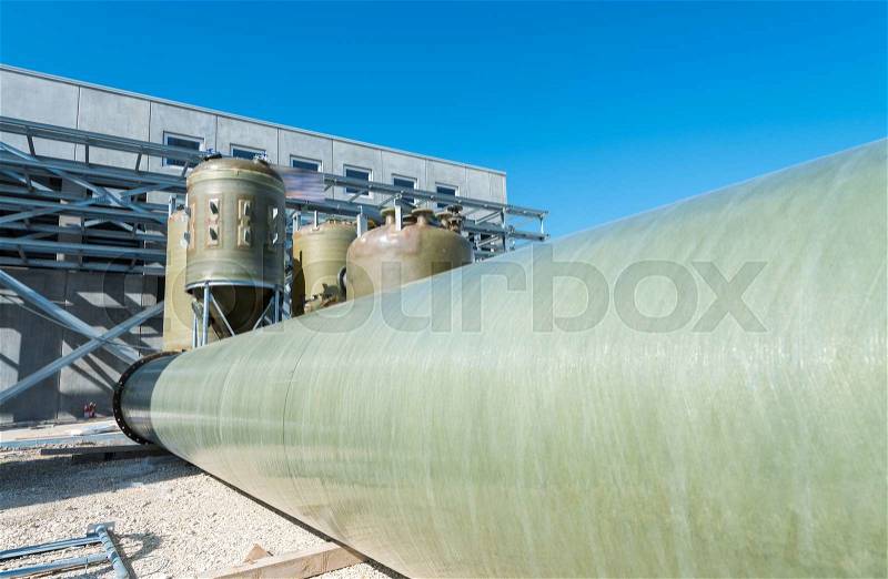 Plastic cilynders in industrial environment, stock photo