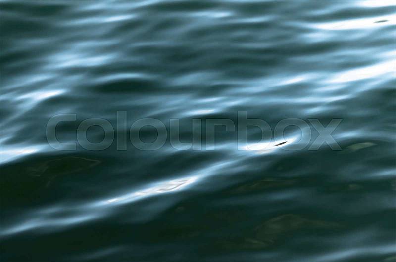 Dark blue black flowing river water surface, background photo texture, stock photo