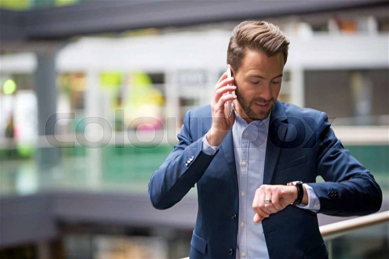 View of a Young attractive man being late to an appointment, stock photo