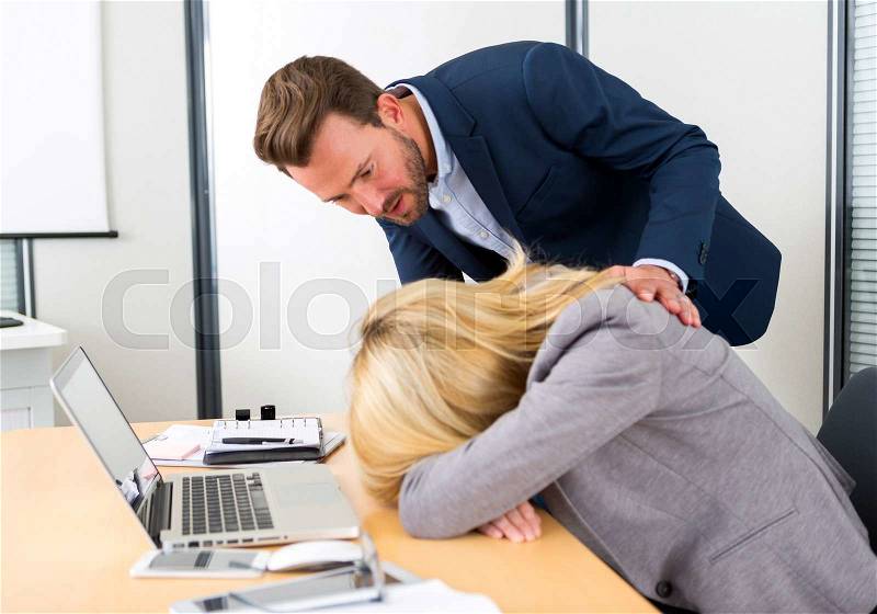 View of a Young attractive woman ill-at-ease at work, stock photo