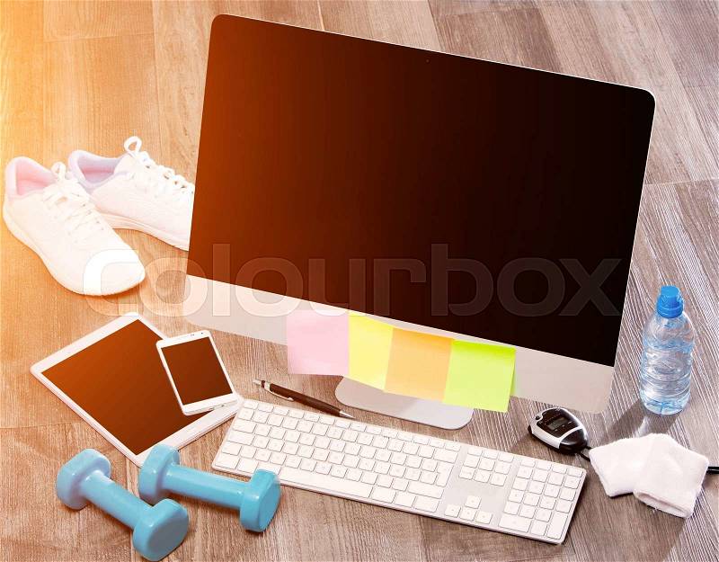 View of a Wood sportman\'s desk in high definition with laptop, tablet and mobile , stock photo