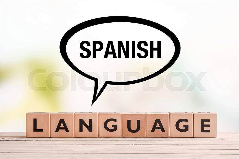 Spanish language lesson sign made of cubes on a table, stock photo