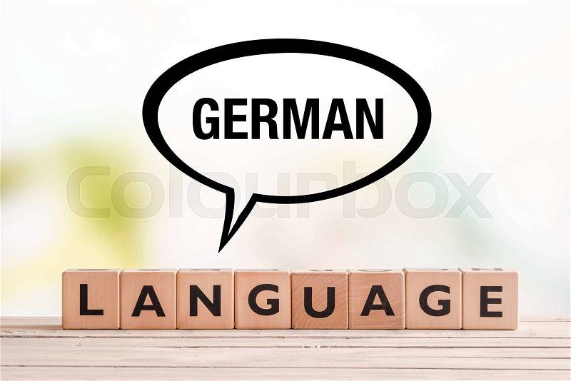 German language lesson sign made of cubes on a table, stock photo