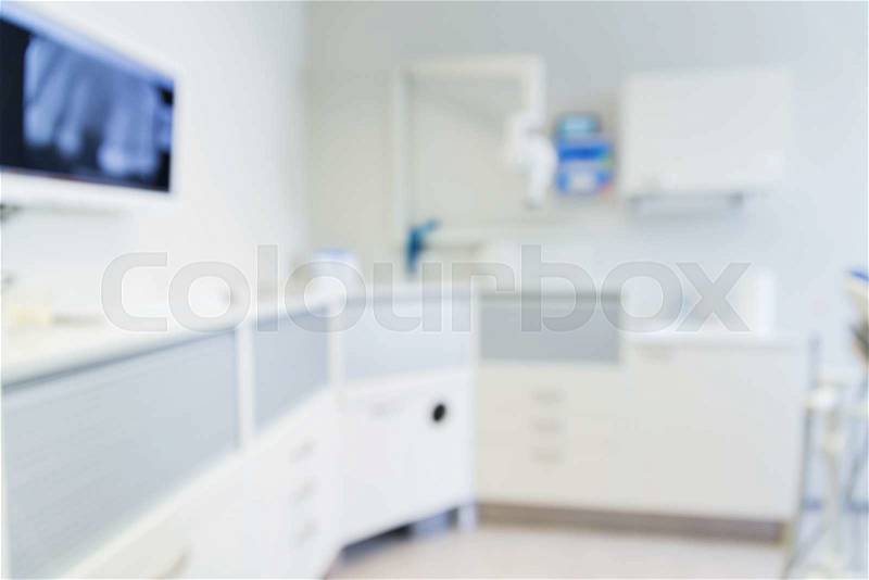Dentistry, medicine and stomatology concept - blurred modern dental clinic office interior bokeh, stock photo