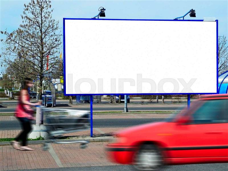 Billboard and a red going car at the shopping center, stock photo