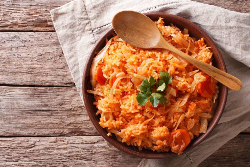 Greek food lahanorizo rice with cabbage in a bowl on the table. horizontal view from above , stock photo