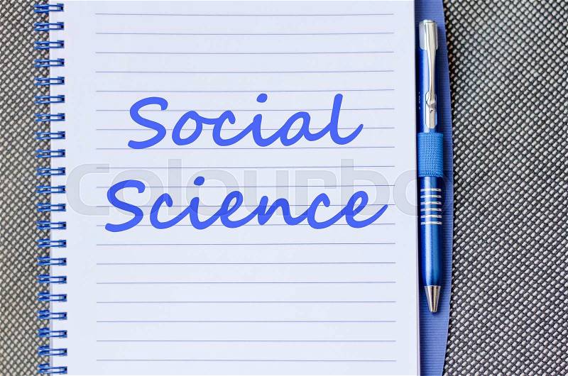 Social science text concept write on notebook with pen, stock photo
