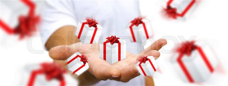 Man celebrating christmas holding gift in his hand, stock photo