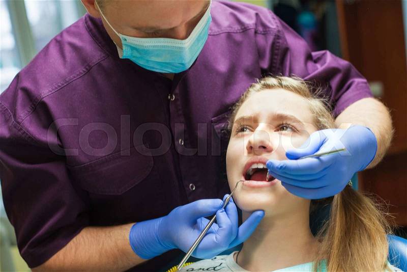 Medical dentist procedure of teeth polishing with clean, stock photo