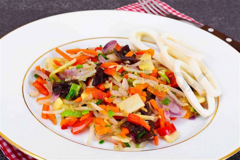 Healthy, diet: Mushrooms mun, bamboo shoots, soy sprouts, peppers and leeks with squid Studio Photo, stock photo