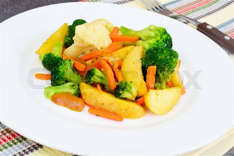 Steamed Vegetables Potatoes, Carrots, Cauliflower and Broccoli Studio Photo, stock photo