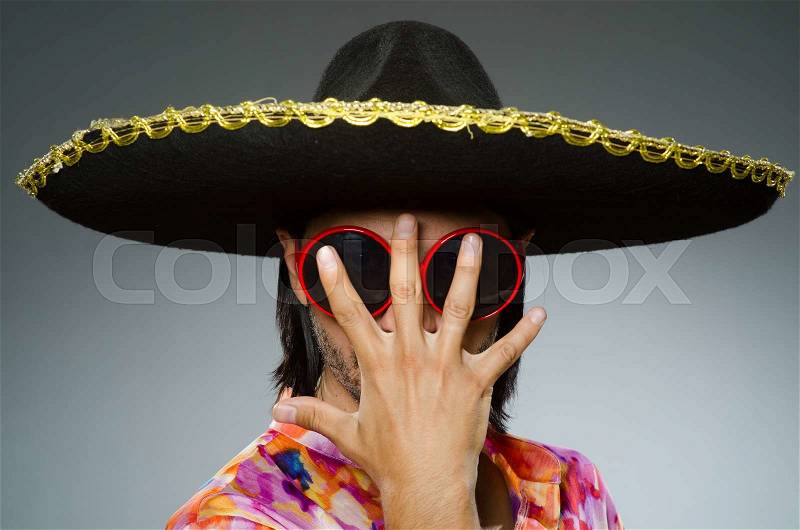 Young mexican man wearing sombrero, stock photo