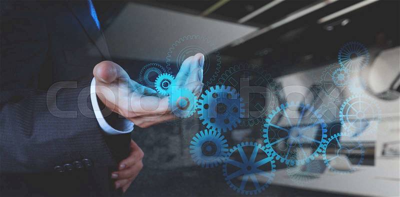 Double exposure of businessman hand working with cog gear to success as concept, stock photo