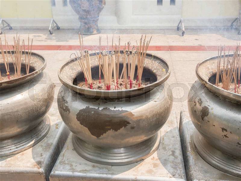 Incense sticks in the incense burner at the temple, stock photo