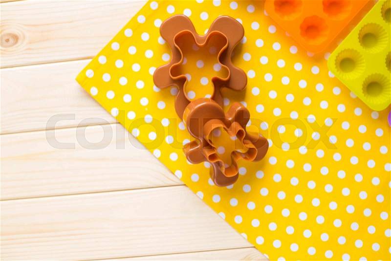 Bake tools for cookie and cake mould for muffin and cupcake on white wooden background, top view, stock photo
