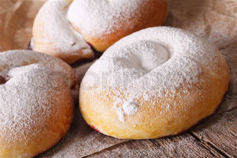 Spanish ensaimadas sweet buns with powdered sugar close-up on the table. horizontal , stock photo