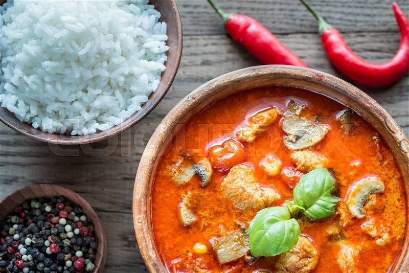 Thai red chicken curry with white rice, stock photo