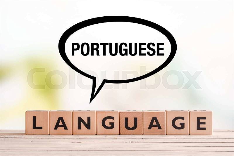 Portuguese language lesson sign made of cubes on a table, stock photo