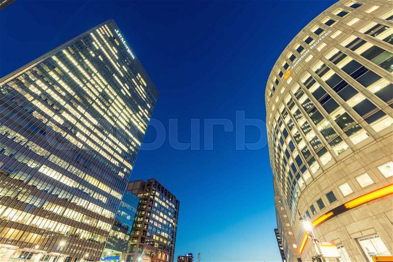 LONDON - JUNE 29, 2015: Buildings of Canary Wharf at night. Canary Wharf is London business district, stock photo
