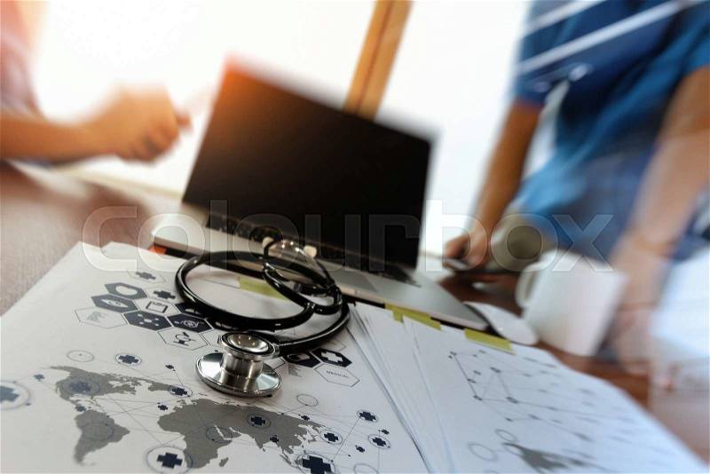 Team doctor working with laptop computer in medical workspace office and medical network media diagram as concept, stock photo