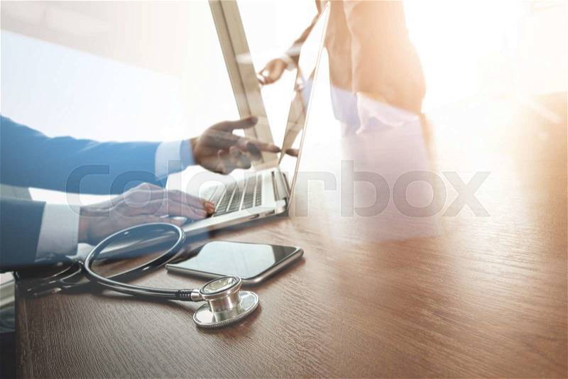 Team doctor working with laptop computer in medical workspace office and medical network media diagram as concept , stock photo