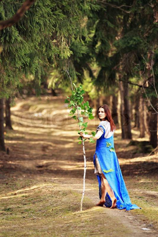 Young woman in spring countryside scenery. Belarus, stock photo