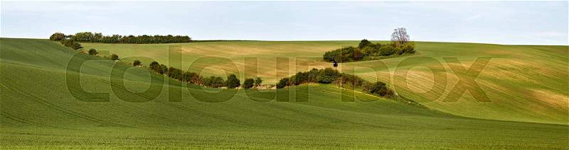 Hunting box in Green spring hills. Arable lands in Czech Moravia. April, stock photo