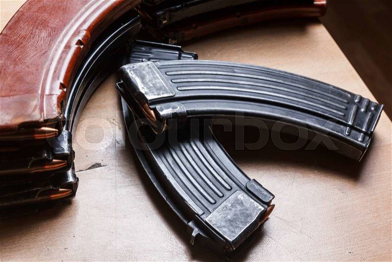 7.62 and 5.56 ammo for machine guns with loaded magazines 7.62 ammo for machine guns with loaded magazines on table, stock photo