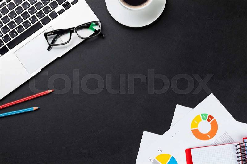 Office leather desk table with laptop, coffee cup, notepad and reports. Top view with copy space, stock photo