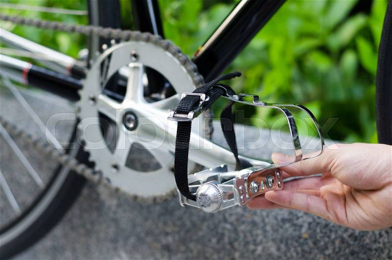 Close up of hand with bicycle pedal , stock photo