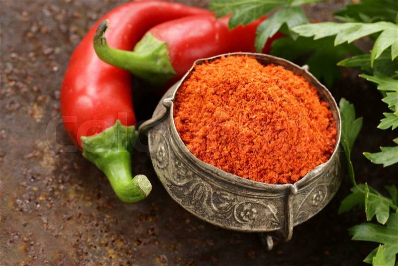 Red spice paprika pepper on iron old background, stock photo