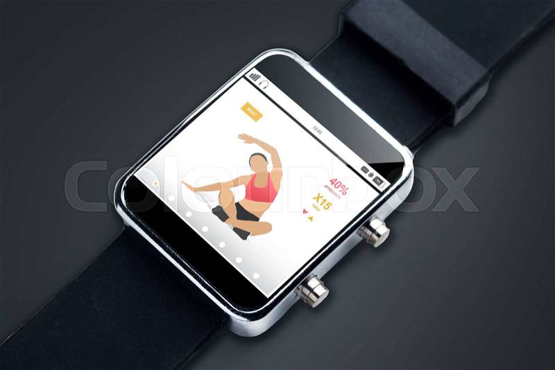 Modern technology, sport, fitness, object and media concept - close up of black smart watch with sports application on screen, stock photo